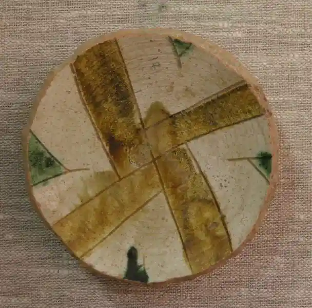 Cross design on a glazed clay bowl